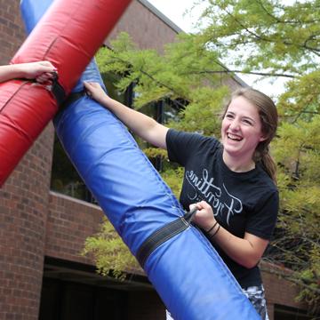 A student enjoys playing a game during the Fall Cav Kickoff event.